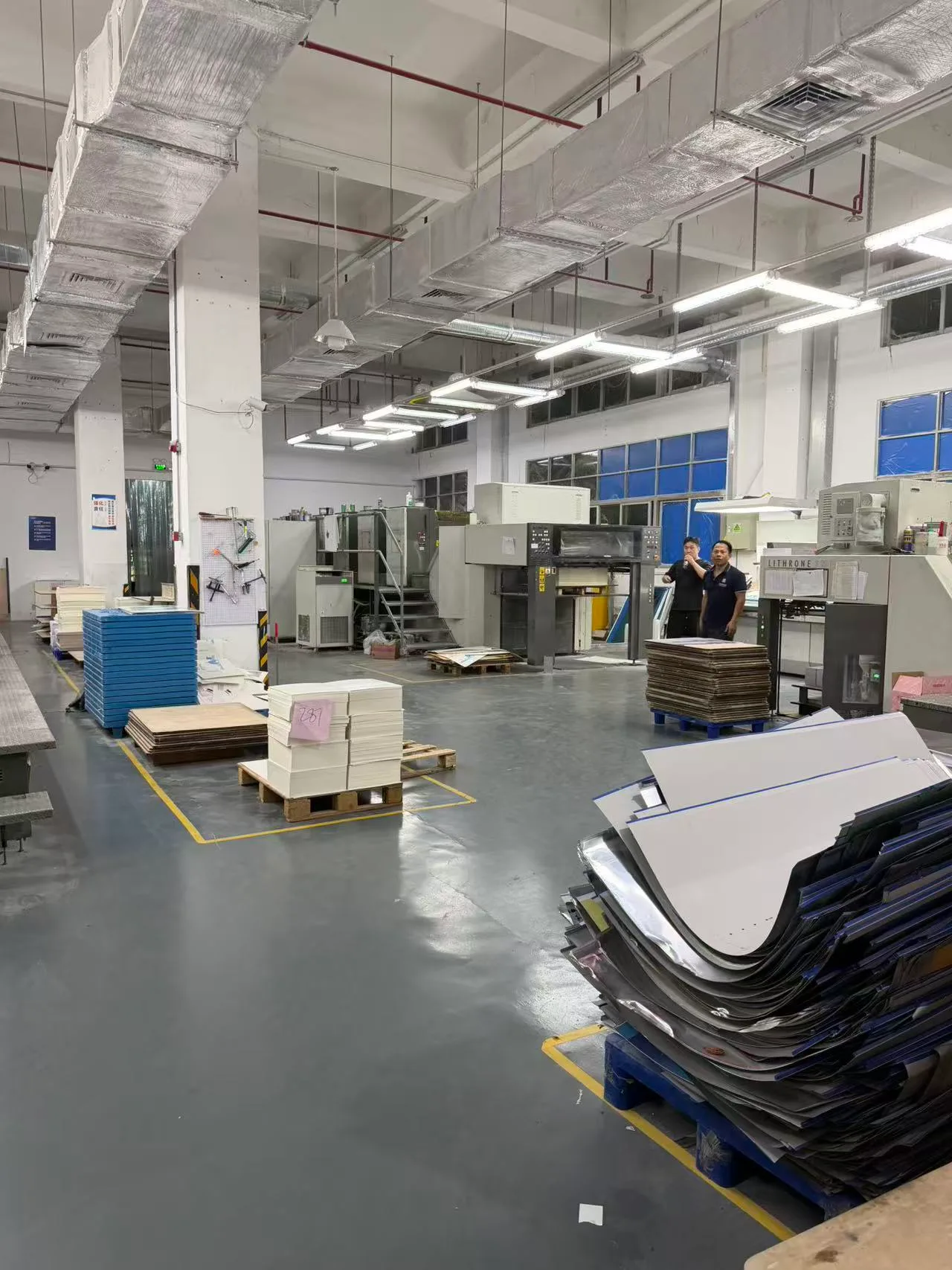 Factory operators running Lithrone offset press